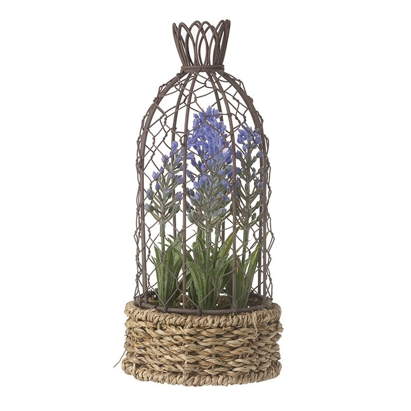 Artificial lavender plant inside a wire birdcage basket.