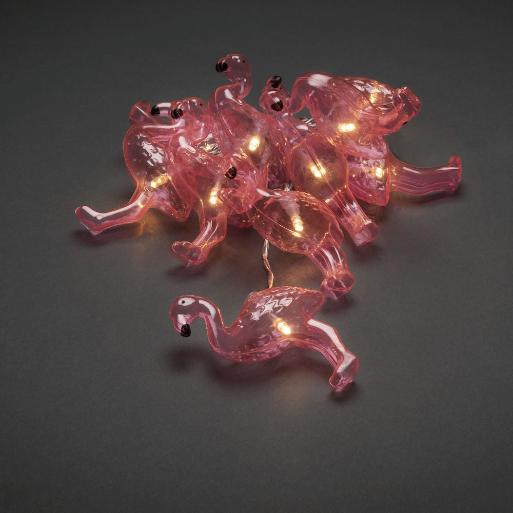 konstsmide flamingo battery lights lay out on a plain grey background