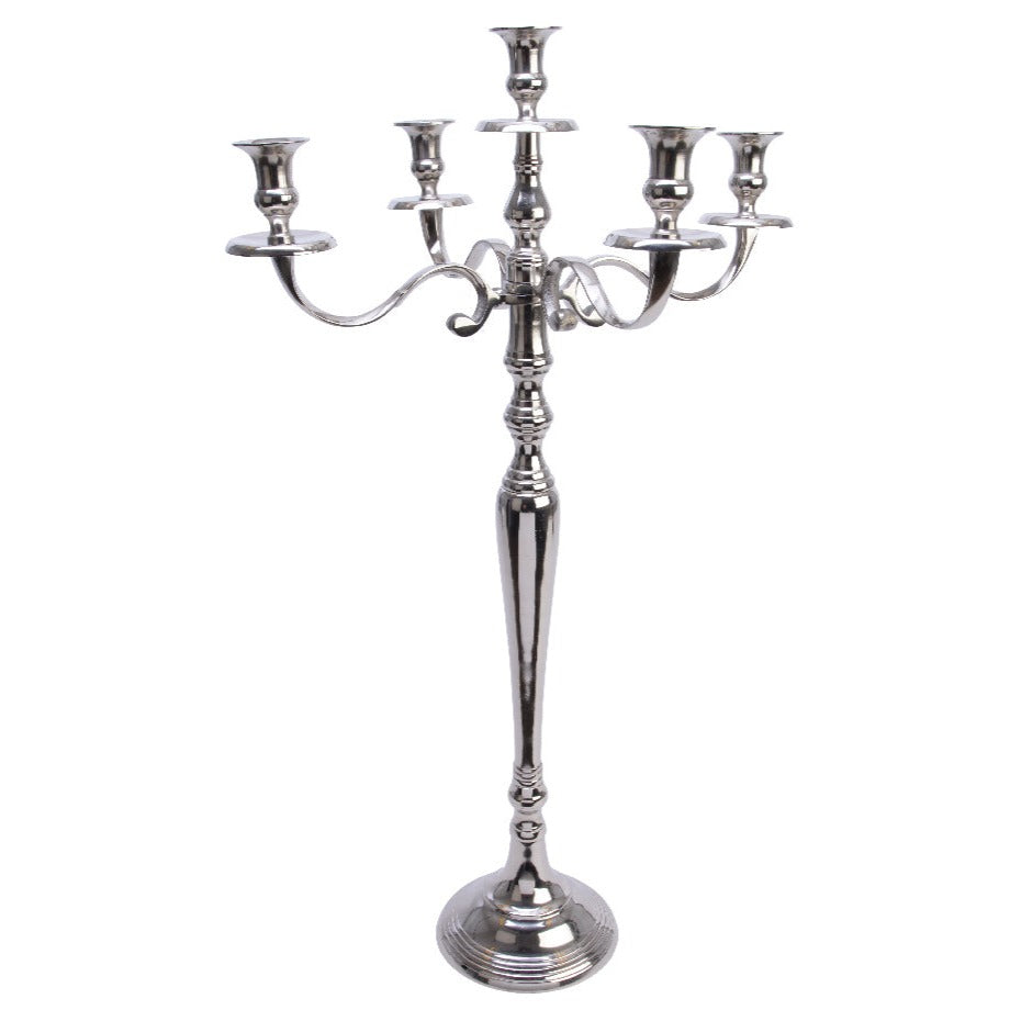 A silver aluminum candelabra with five candle holders, featuring a classic design, standing on a round base.