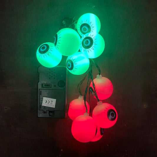 Red and green LED eye ball lights clumped together to show them with the battery box