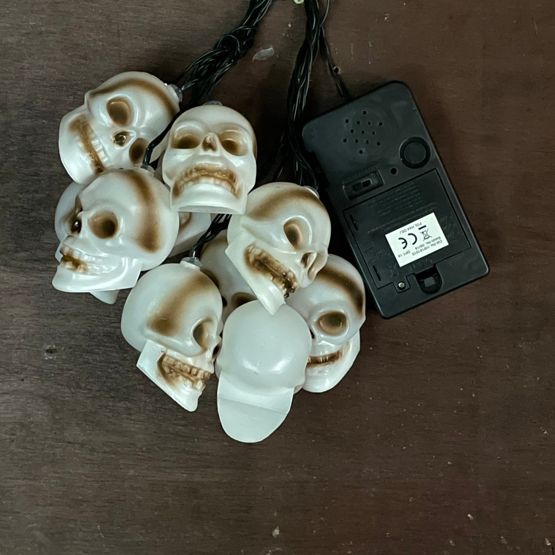 skull lights with there battery and noise box on a plain background to show off the lights clearer
