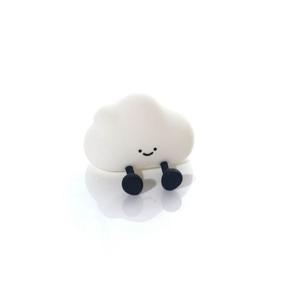 Cloud-shaped night light with a smiley face and black accents on a white background