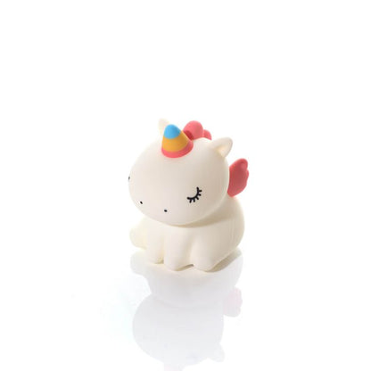 Unicorn-shaped silicone night light with a colourful horn on a white background