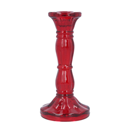 Red glass candle holder on a white background