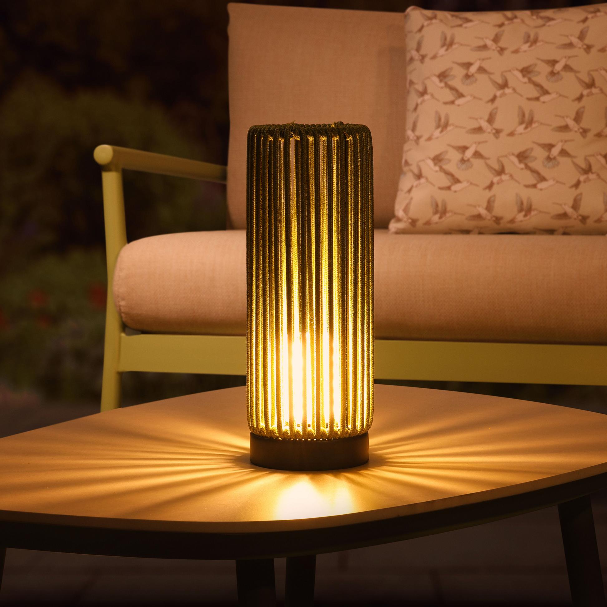 Decorative outdoor lamp on a table with a blurred background