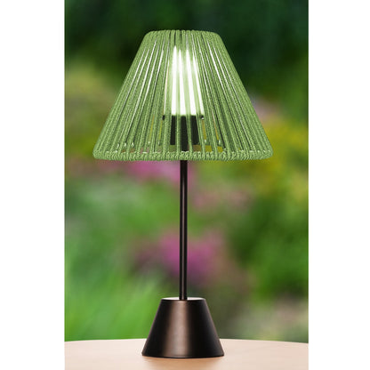 Green outdoor lamp with pleated shade on a blurred natural background