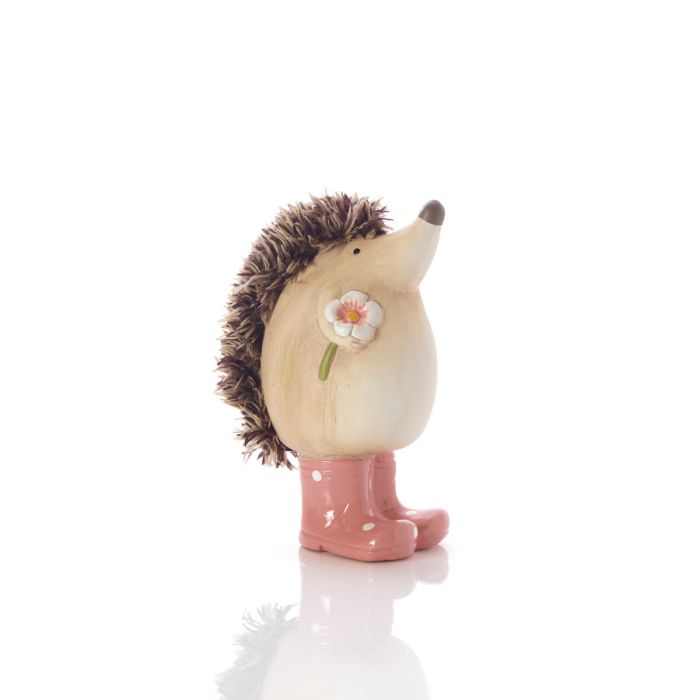 Hedgehog figurine wearing pink boots with a flower on a white background
