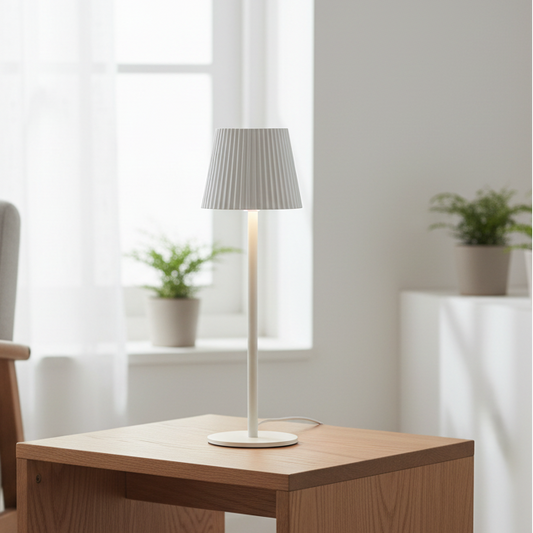 Modern lamp on a wooden side table in a bright room with a chair and plants.
