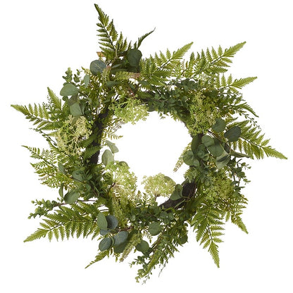 A circular wreath made of green fern leaves.