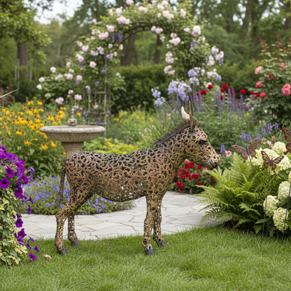 Decorative metal animal sculpture in a garden setting with flowers and a fountain.