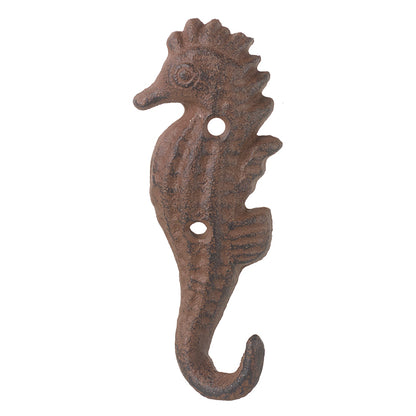 A brown metal hook in the shape of a seahorse.
