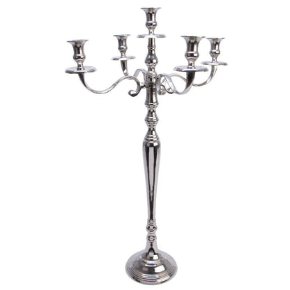 A silver aluminum candelabra with five candle holders, featuring a classic design, standing on a round base.